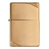 Gold-colored metal lighter with diagonal corner accents.