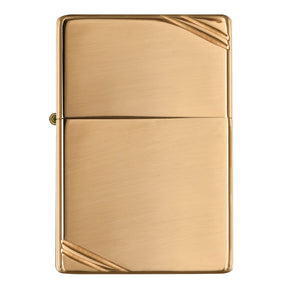 Gold-colored metal lighter with diagonal corner accents.