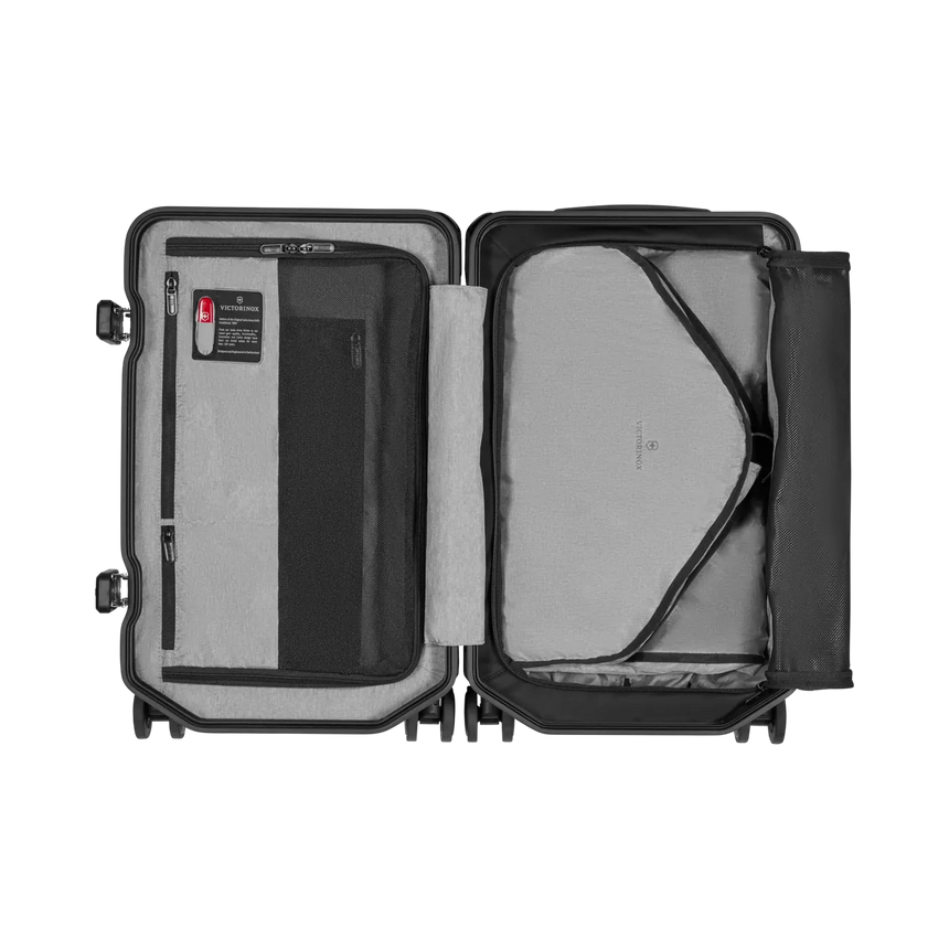 Open suitcase with interior compartments and straps visible.