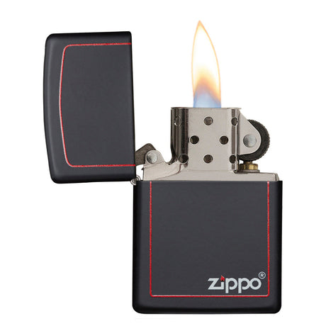 Lit black Zippo lighter with red trim and visible flame.