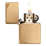 Gold-colored metal lighter with an open flame.