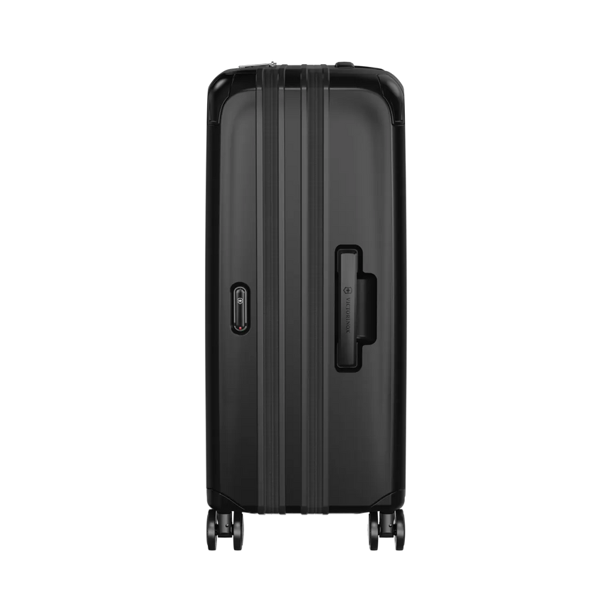 Black hardshell rolling suitcase with vertical ridges and a side handle.