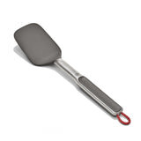 Stainless steel spatula with a gray silicone head and red hanging loop.