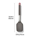 Kitchen spatula with a gray silicone head and metal handle.