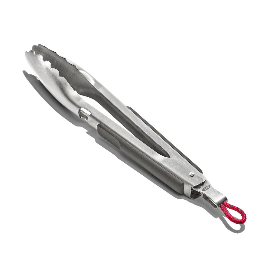 Kitchen tongs with stainless steel construction and a red loop handle.