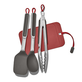 Set of kitchen utensils including spatulas and tongs with red accents and a red holder.