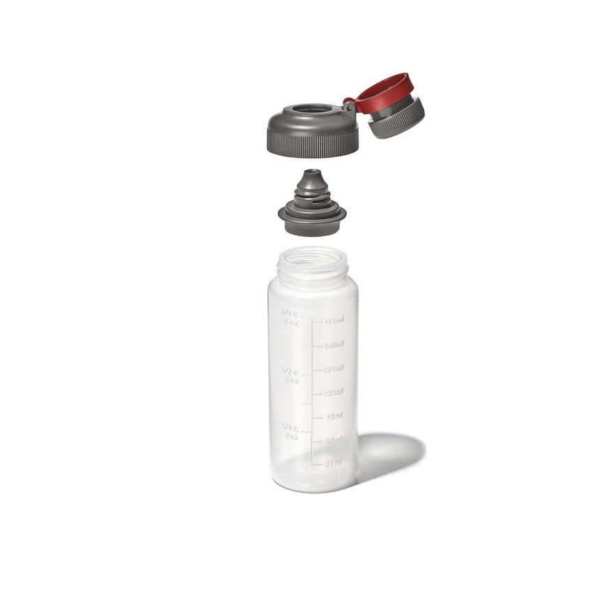 Reusable plastic water bottle with a detachable cap and spout.