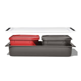 Set of stackable plastic storage containers in red, gray, and white colors.