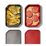 Four food containers with grilled zucchini and raw hamburger patties.