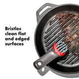 Cast iron grill pan with a cleaning brush featuring bristles designed for flat and edged surfaces.