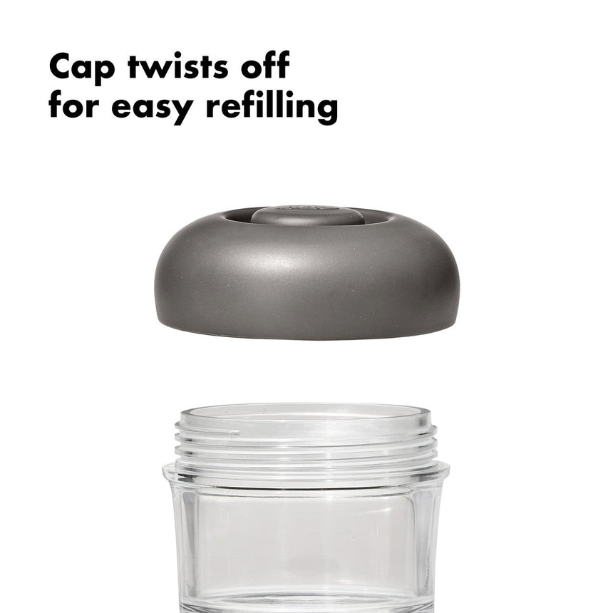 Clear jar or container with a gray twist-off cap.