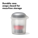 Translucent plastic container with a domed silver lid.