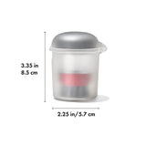 Translucent plastic container with a gray lid and a red band visible inside.