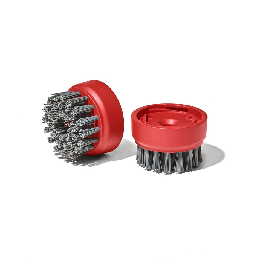 Circular red brushes with stiff gray bristles.