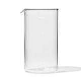 Clear glass beaker or measuring container with a pouring spout.