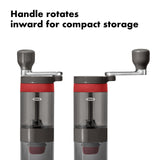 Manual coffee grinder with a rotatable handle for compact storage.