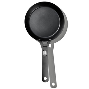 Black non-stick frying pan with a long handle.