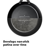 Black frying pan with a partially developed non-stick patina surface.