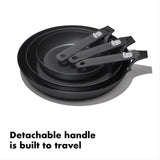 Set of three nonstick frying pans with detachable handles.