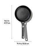 Black non-stick frying pan with a long handle.