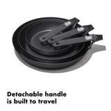 Set of three nonstick frying pans with detachable handles.