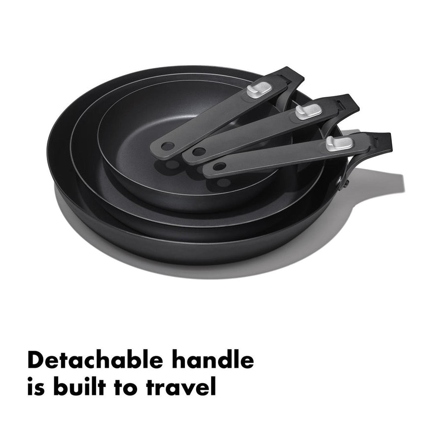 Set of three nonstick frying pans with detachable handles.