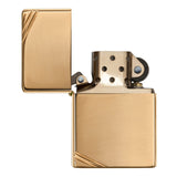 Gold-colored metal flip lighter with a brushed finish and diagonal corner accents.