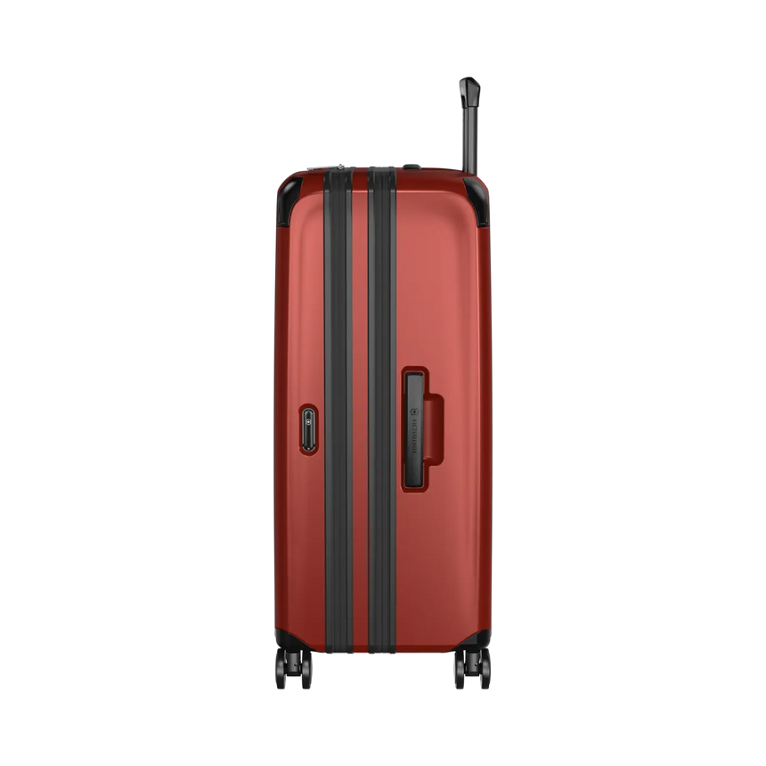 Red hardshell suitcase with black trim and wheels.