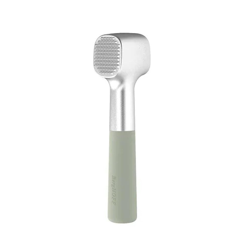 Handheld meat tenderizer with a silver head and light green handle.