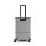 Gray hardshell rolling suitcase with an extendable handle and wheels.