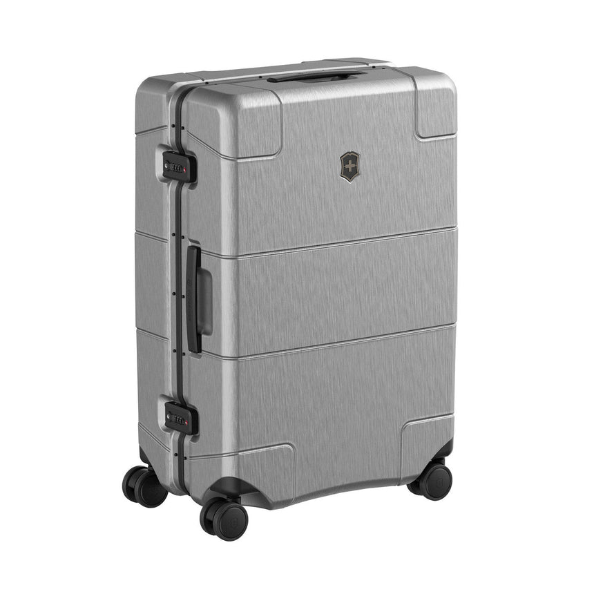 Silver hardshell rolling suitcase with multiple compartments and wheels.