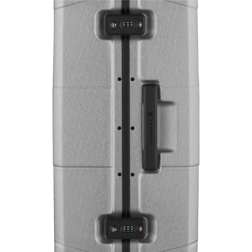 Hardshell suitcase with combination locks and a handle.