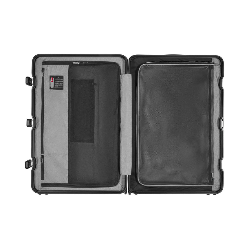 Open hard-shell suitcase with interior compartments and pockets.