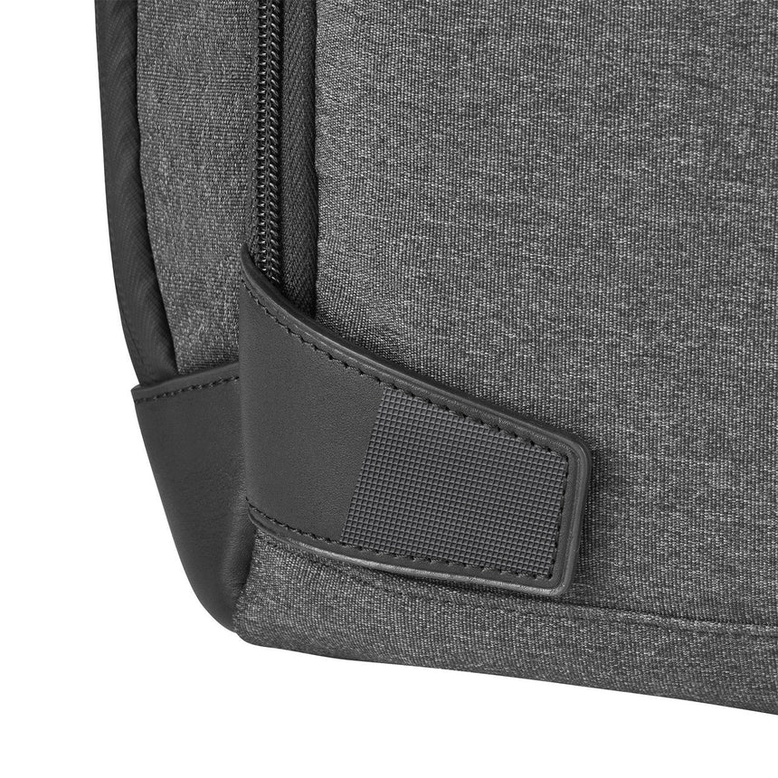 Close-up of a gray fabric backpack or laptop bag with a zipper and leather trim detail.