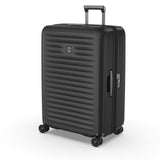 Black hardshell suitcase with horizontal ridges and wheels.