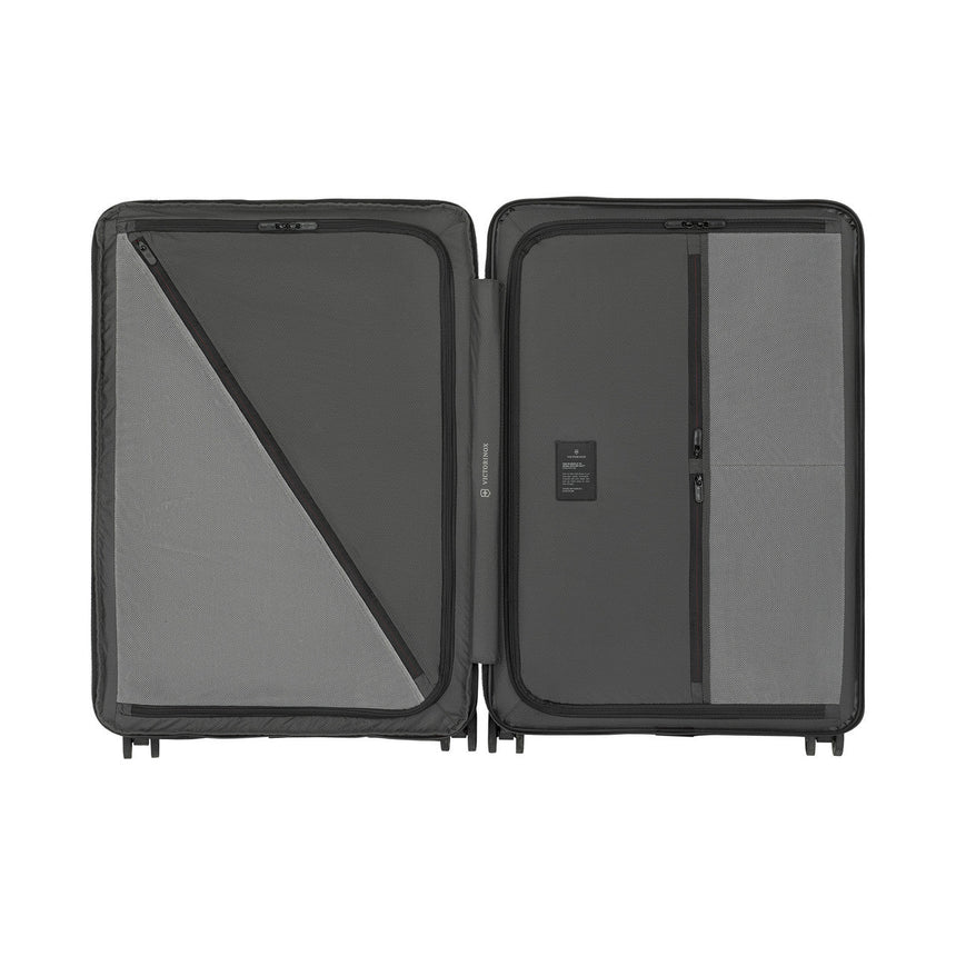 Open suitcase with compartments for organizing belongings.