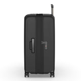 Black hardshell rolling suitcase with telescoping handle and wheels.