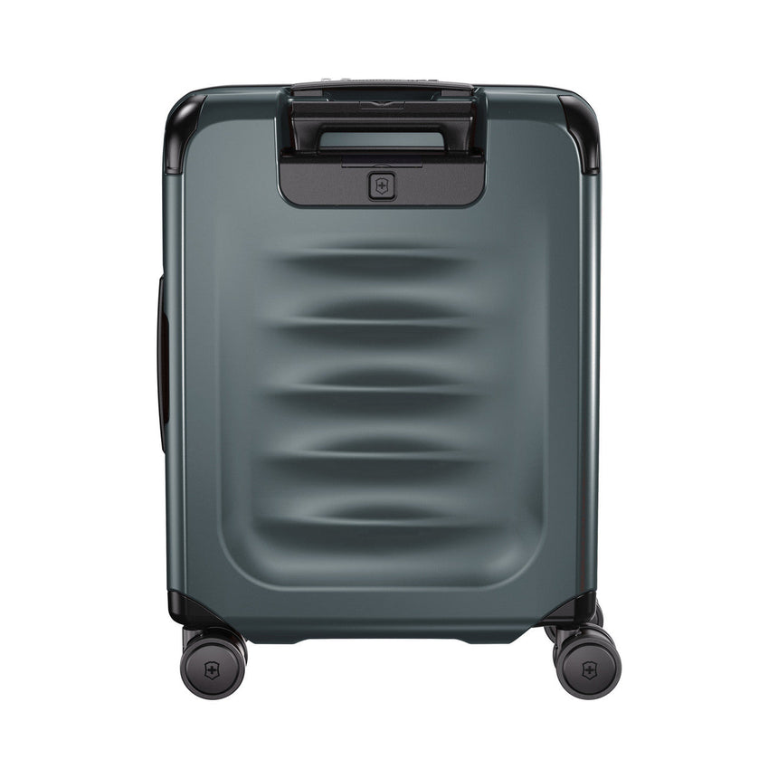 Gray hardshell rolling suitcase with horizontal ridges and a top handle.