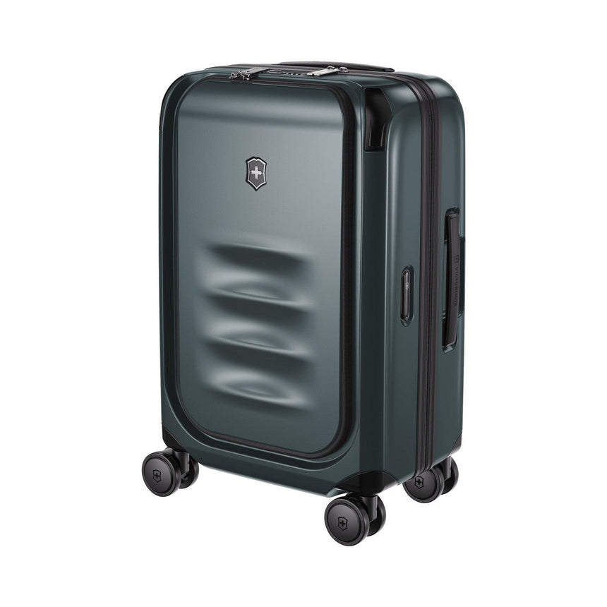 Dark green hardshell rolling suitcase with a textured front panel and four wheels.