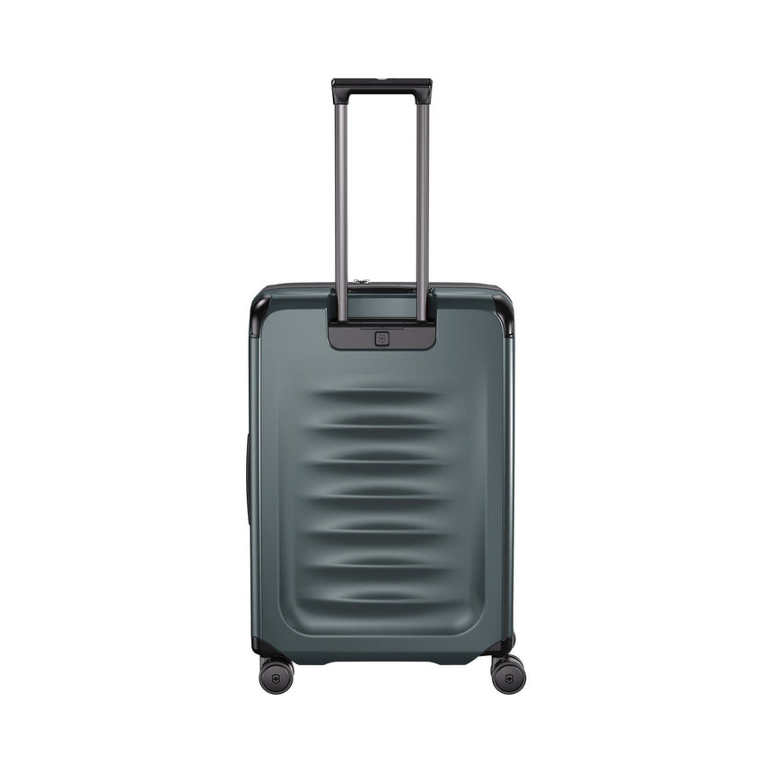 Dark gray hardshell rolling suitcase with an extendable handle and wheels.
