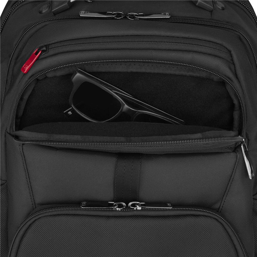 Black backpack with multiple zippered compartments and a pair of sunglasses visible in one pocket.