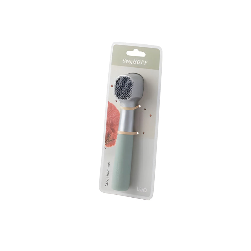 Handheld pet grooming brush with a mint green handle in retail packaging.
