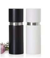 Salt and pepper grinder set in black and white.