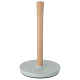 Paper towel holder with a wooden post and a light-colored base.