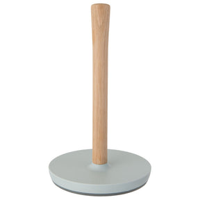 Paper towel holder with a wooden post and a light-colored base.