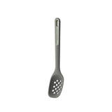 Gray slotted spoon or spatula with holes in its scoop.