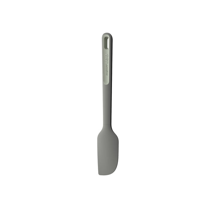 Gray silicone spatula with a long handle.