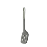 Gray plastic slotted spatula with a long handle.