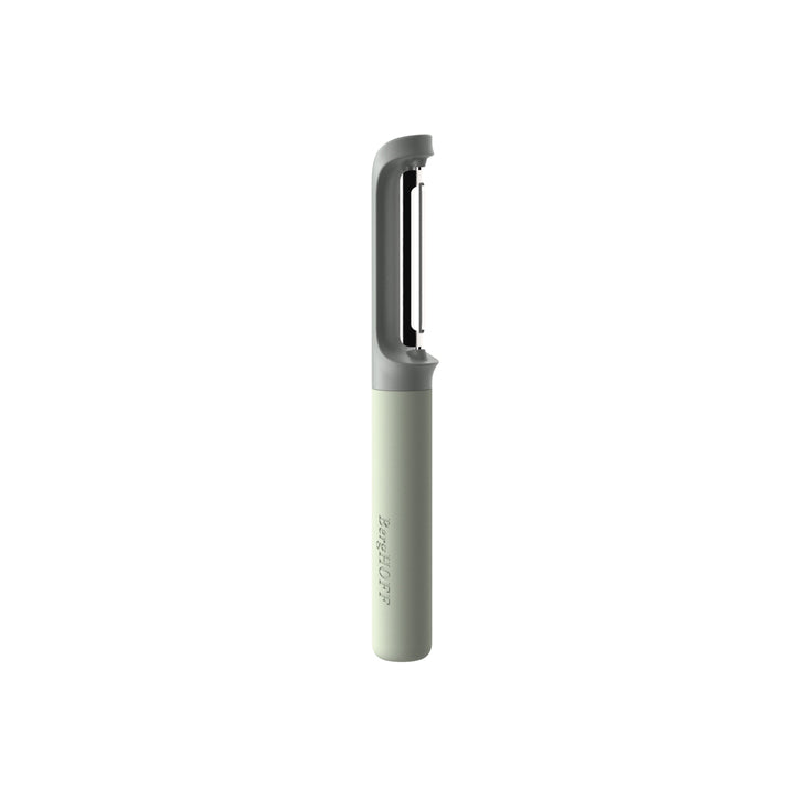 Sleek, minimalist vegetable peeler with a light green handle and metallic blade.