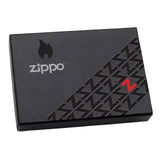Black Zippo lighter box with a geometric pattern and red accent.